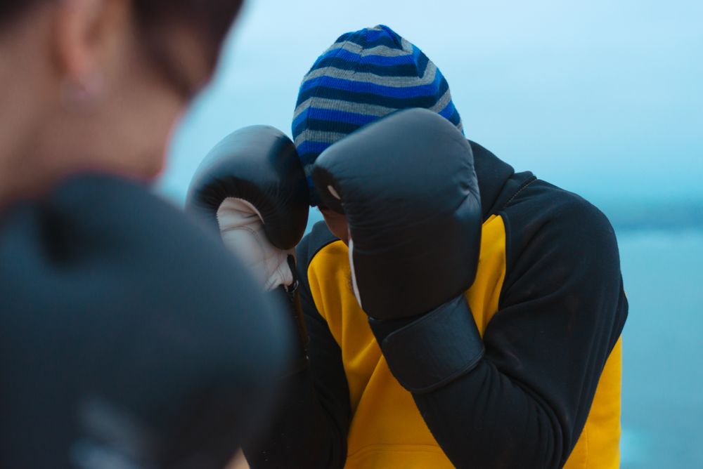 Boxers exercising on cliff
