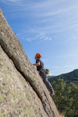 Man climbing a rock
