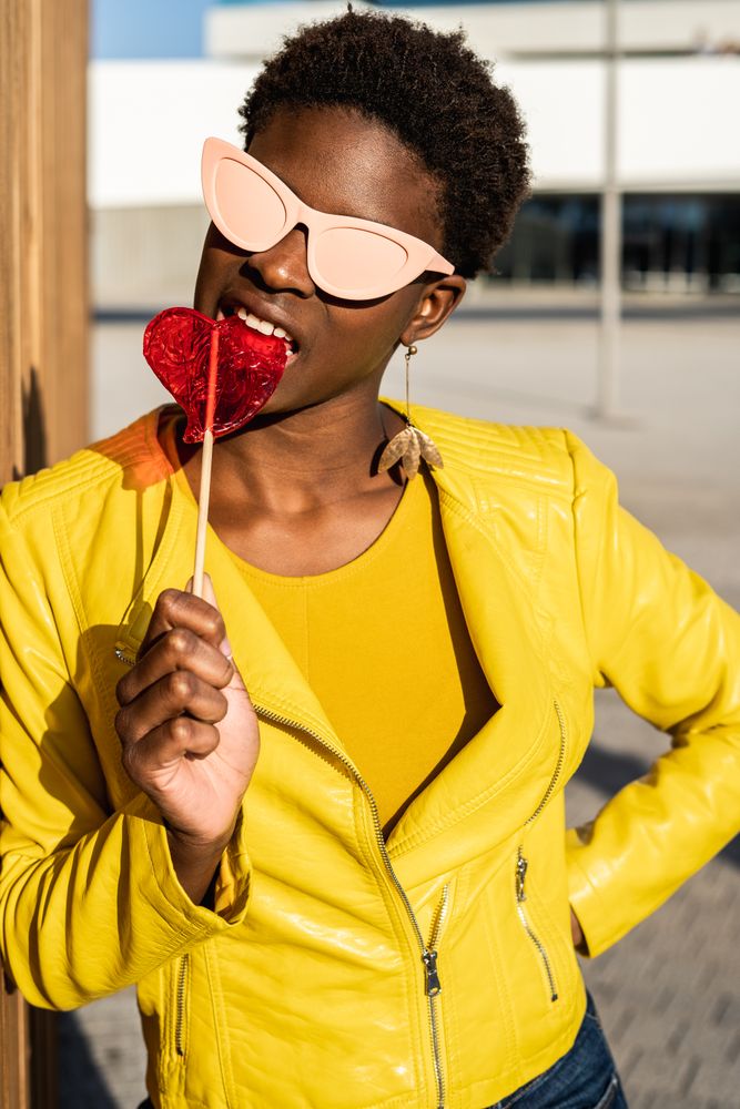 Black woman eating candy