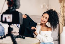Trendy woman holding up skirt to camera