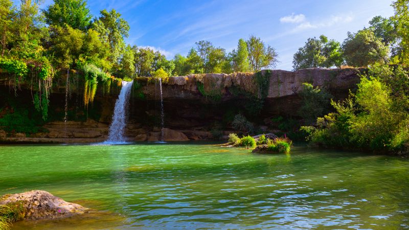 View of beautiful waterfall and lake