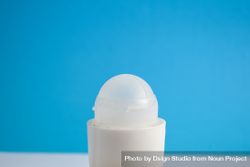 Top of deodorant bottle on blue background bGRRqe