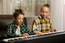 Brothers Sharing Piano Moments