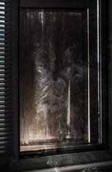 Smoke near a window frame