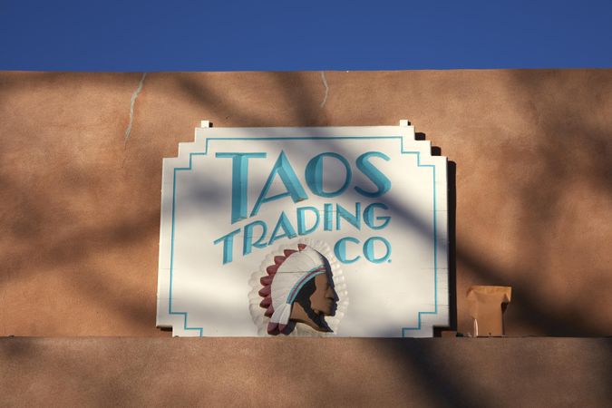 Sign for the Taos Trading Co., a gift shop in Taos, New Mexico