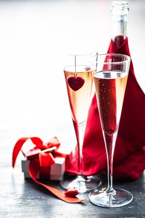 Two champagne glasses with small gift box for Valentine's Day