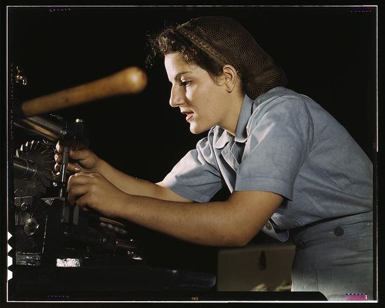 Fort Worth, TX, USA - 1942: Woman working on transport parts in the hand mill
