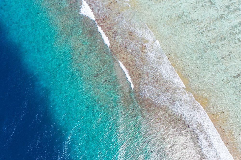 Blue waves coming in on a Maldives beach