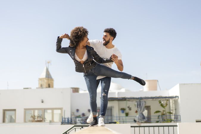 Young couple having fun on street