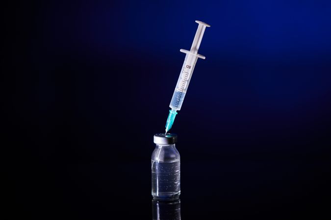 Injection with vaccine for COVID test in studio