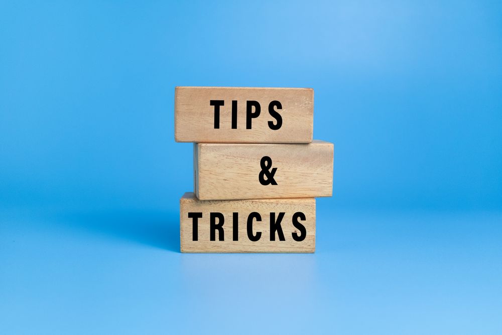 tips and tricks words on wooden blocks isolated on blue background