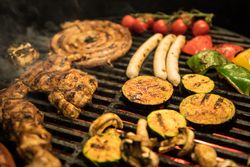 Vegetables and meat on grill