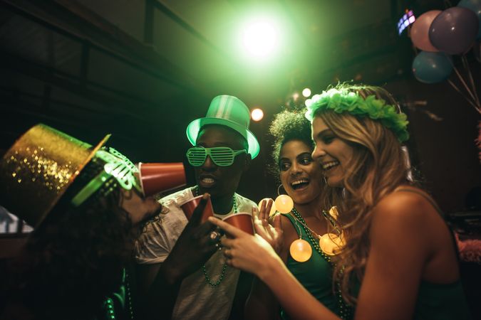 Friends celebrating St. Patrick's Day in nightclub