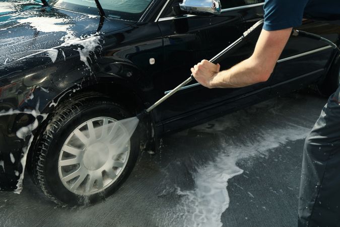 A man washes a car. Clear car concept