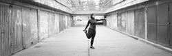 Woman stretching her legs before running