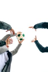 Three generations playing with soccer ball