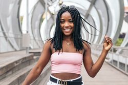 Portrait of a Black young woman enjoying the summer in the city
