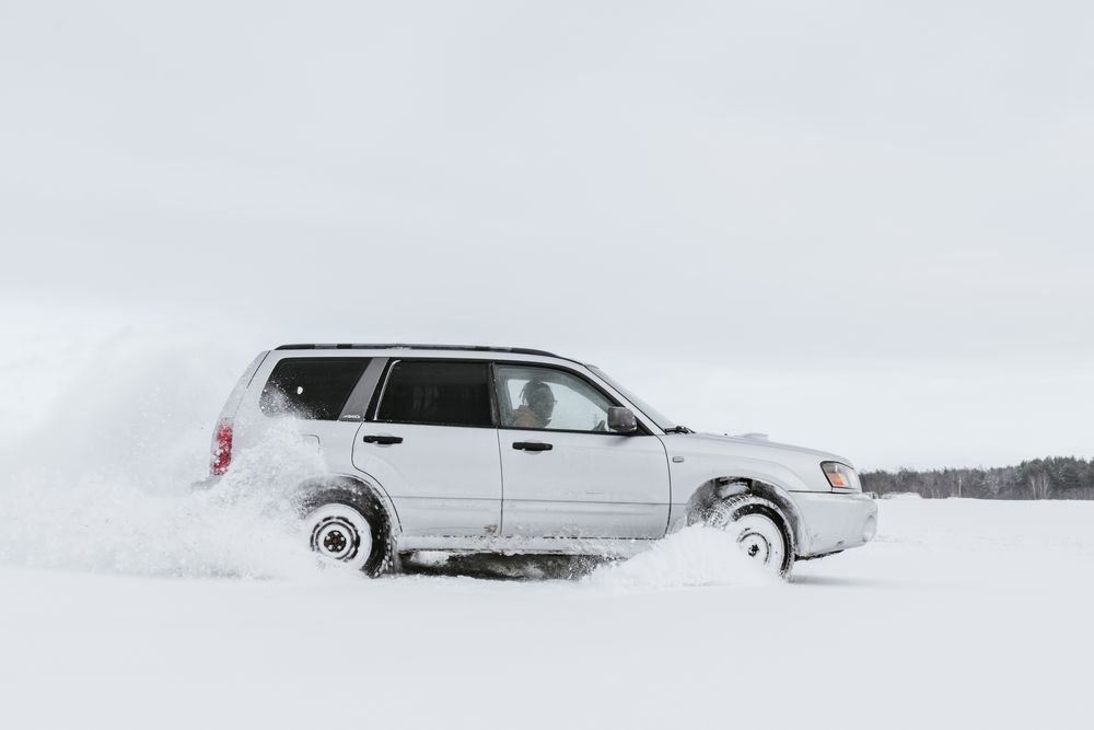Car driving on snow field