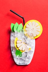 Silhouette of a glass of mojito made with cardboard with real ice