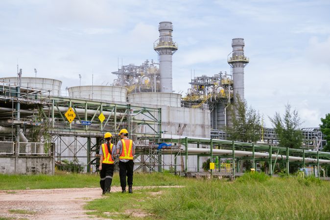 Engineer worker checking project at petrochemical factory or refinery oil plant industrial.