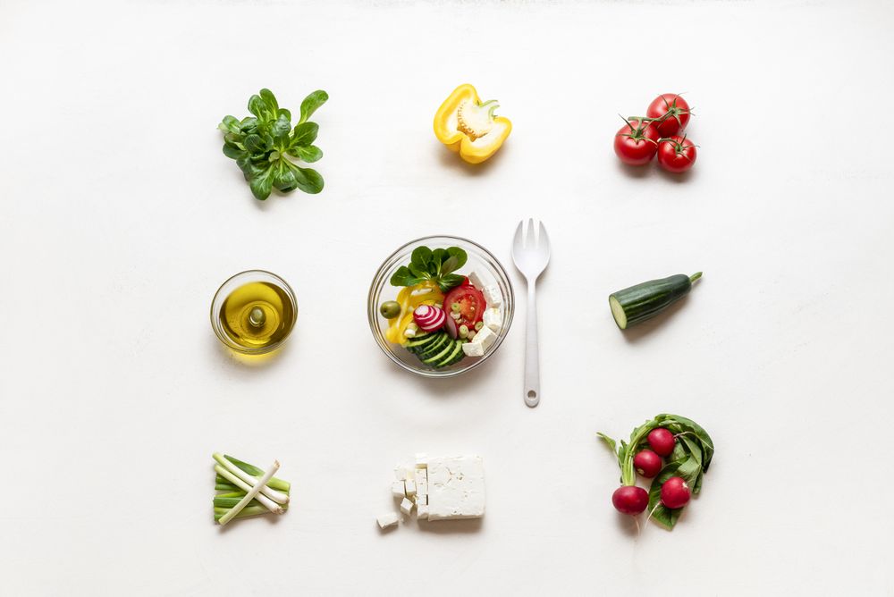 Summer salad bowl and ingredients