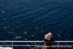 Looking down at blonde woman on deck of boat bD3MJ4