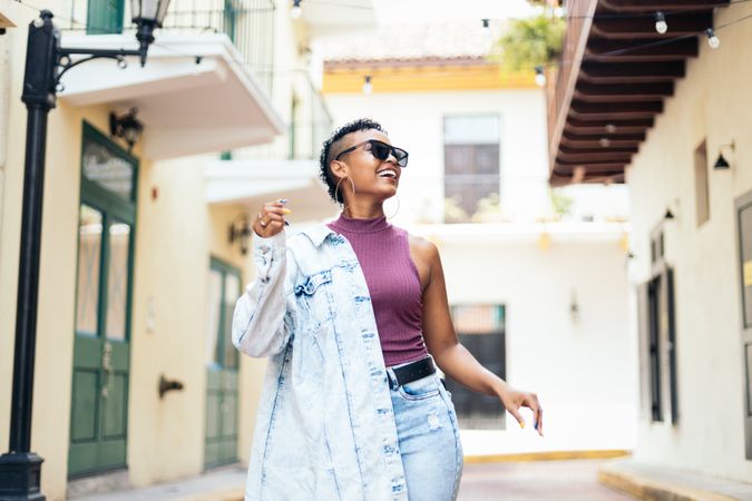 Portrait of a cool Latin American woman walking in the city