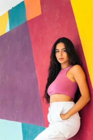 Portrait of a young latina woman, colorful background