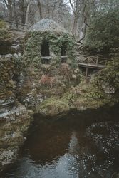 Stone shelter at riverside in Tollymore Forest Park