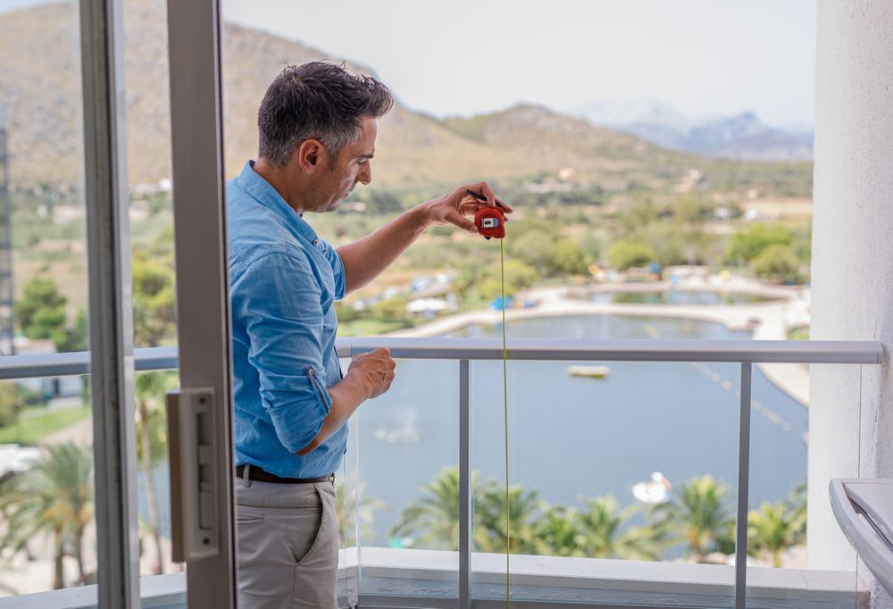 Safety inspector checking balcony railing