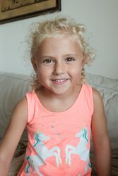 Delighted preteen girl in living room