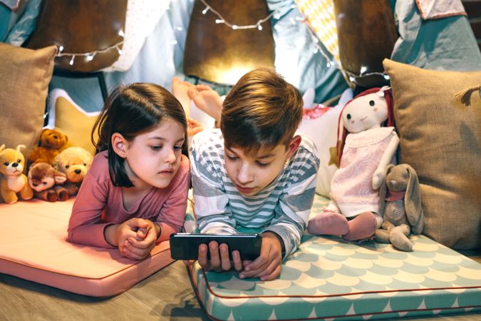 Children watching unsafe content on cellphone without parental supervision at home