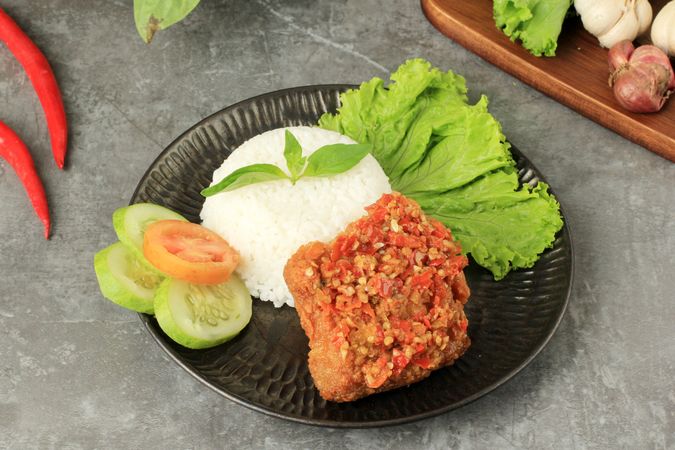 Ayam geprek, popular Indonesian street food made with smashed chicken in sambal bawang