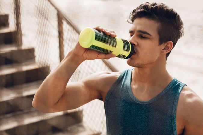 Runner drinking water after exercising