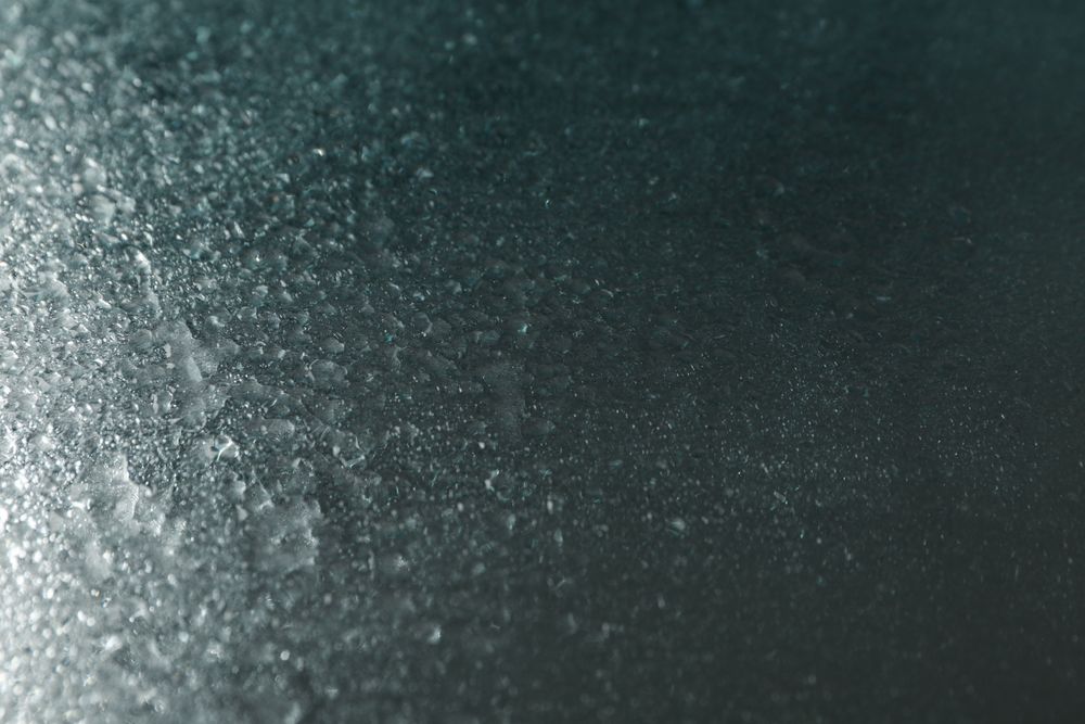 Dewy metallic blue table with droplets