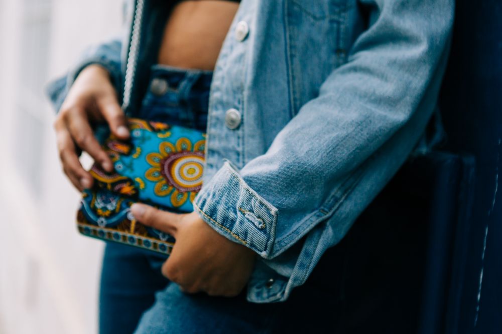 Stylish Black female with fashion bag