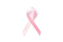 Pink awareness ribbon isolated on blank background, top view
