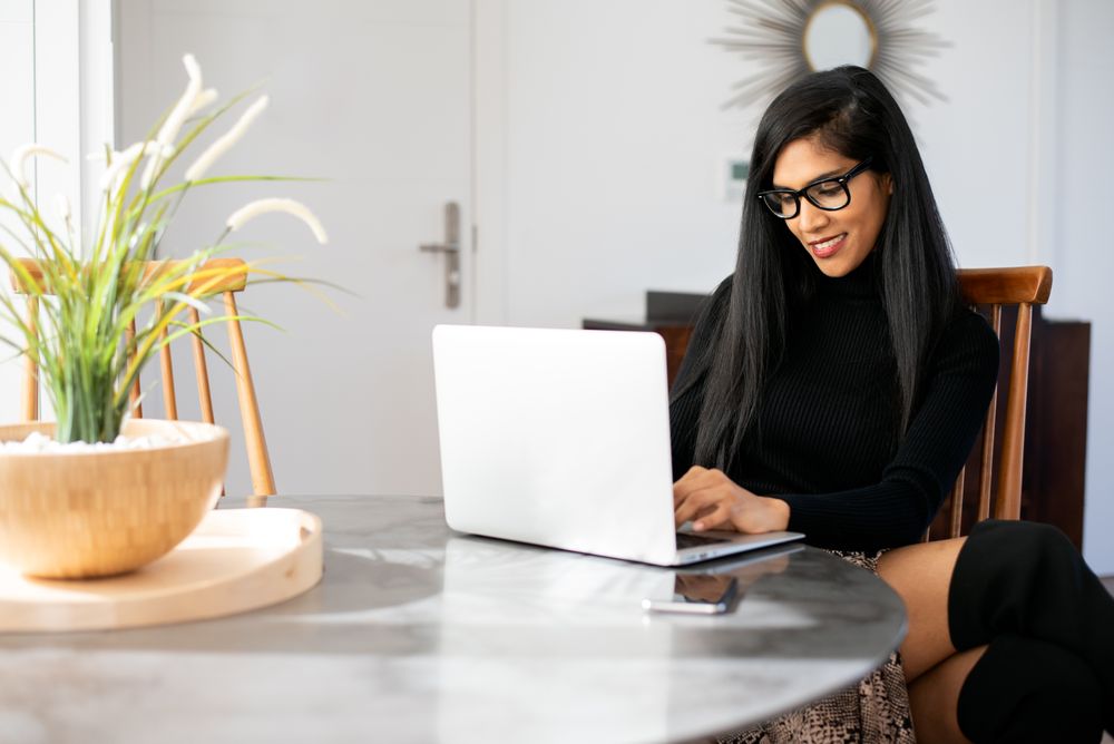 Businesswoman working from home on her computer
