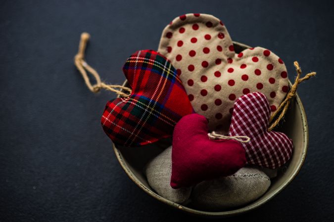 St. Valentines card concept with felt hearts in bowl