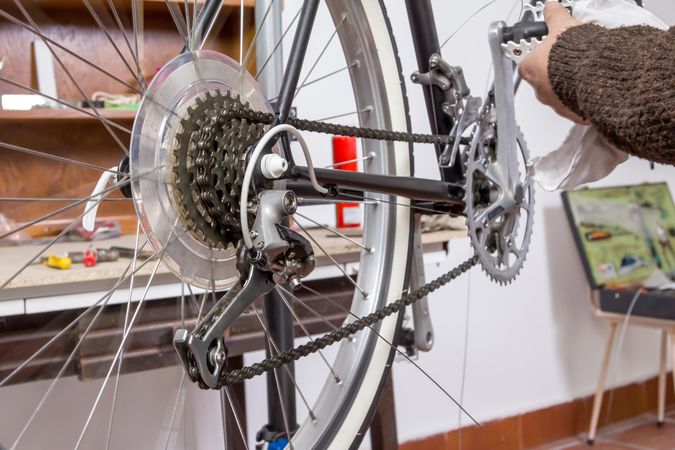 Real bicycle mechanic repairing custom fixie bike