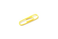 Color paper clip isolated on plain background, closeup