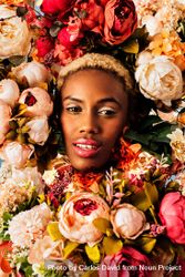 Portrait of Black woman with blonde hair surrounded by flowers 4MOAz0