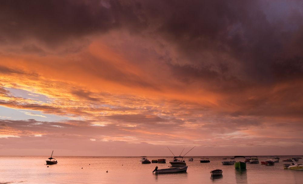 Boats parked at sunset in Indian Ocean