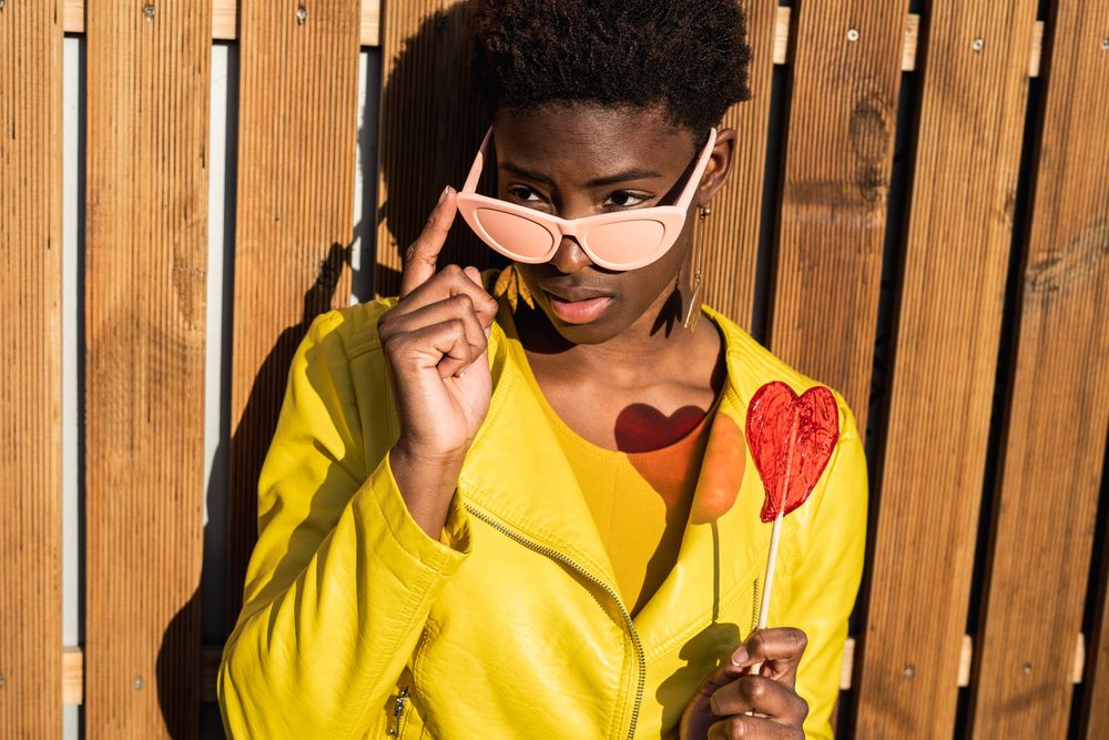 Black woman eating candy