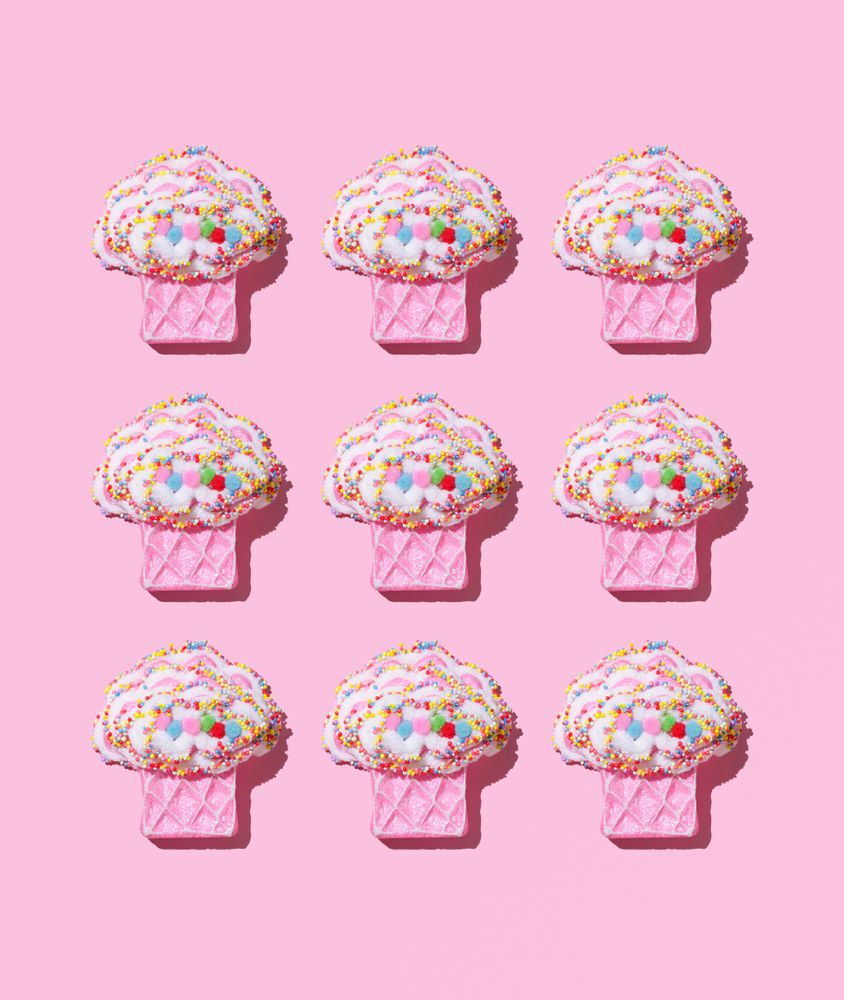 Cute muffin toys on pink background