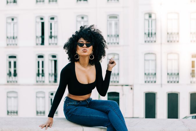 Fashionable female relaxing in city