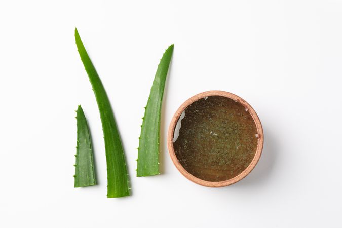 Composition with natural treatment accessories on plain background, top view. Aloe vera