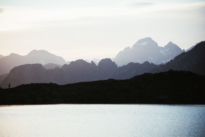 Majestic mountain landscape with human silhouette
