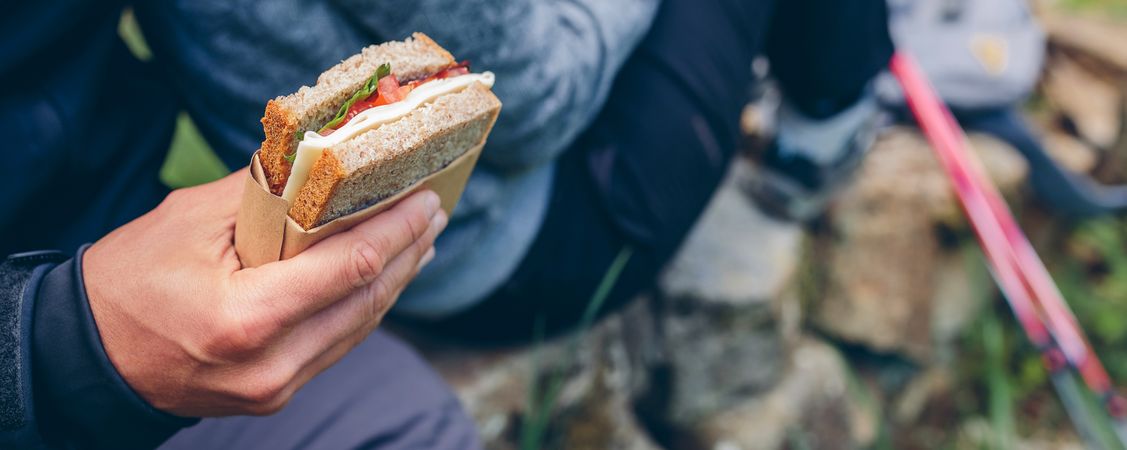 Sandwich that a couple is going to eat doing trekking