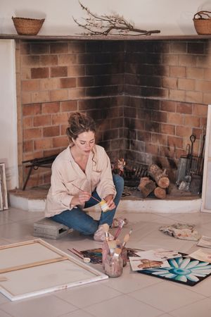 Female artist painting in modern studio